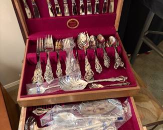 Silver-plated flatware in storage box