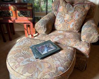Armchair with ottoman and down pillow and shown with signed copy of Polar Express,