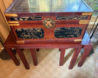 Asian Chest sitting on top of Asian nesting table