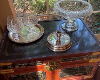 Asisn Trunk on top of Asian nesting tables, with Miksa brandy glasses and silver-plated tray and tapper candle holder, large Crystal pedestal dish