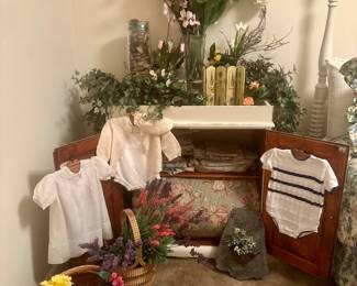 Dry sink with flowers and vintage baby clothes