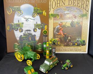 Collection Of John DeereIncluding Metal Signs Toy Tractors  Gas Pump Replicas