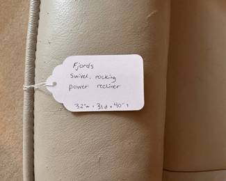 C6 - $200. Fjords Swivel, Rocking, Power Recliner. Off white / Grey Color. *HAS CAT DAMAGE* Measures 32" wide x 31"deep x 40" tall. (Seat is 21" wide - feels narrow) No holes or rips but significant scratches on the arms and back - see photos! If you have cats and this is going to happen anyways this is a great price for a leather power recliner.