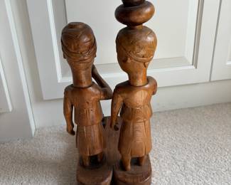 C60 - $20. Tribal Hand Carved Wood Couple. Measures 6" W x 10" D x 14.5" Tall. One piece of the pot is detached but can easily be glued back on.