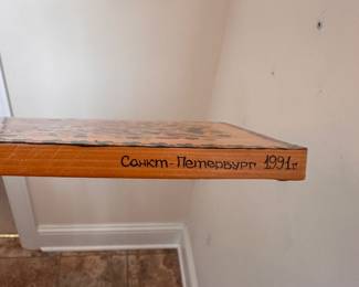 C111 - $20. Russian Hand Painted Cutting Board 1991 & signed. Used as a wall hanging. Measures 7" x 18".