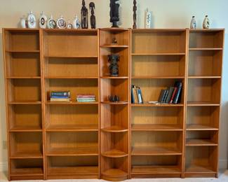 C1 - $200. 5 Piece Bookcase. Shelves are all adjustable. Assembled as it they measure 118.5" across. 2 smaller sections are 19.75" wide x 11.5" deep x 83" tall. 2 larger bookcases are 30.25" wide x 11.5" deep x 83" tall. Center piece could be used on an end or as is. Comes out from the corner 11". Across the front is 16.25".