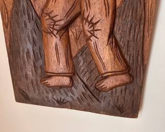 C10 - $30. Carved Relief Wall Art. Measures 12" x 27.5" tall.