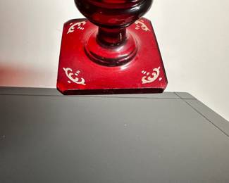 C28 - $15. Cut to Clear Red Glass. Has chip on the underside of the base. Castle carved on one side and a deer on the other.