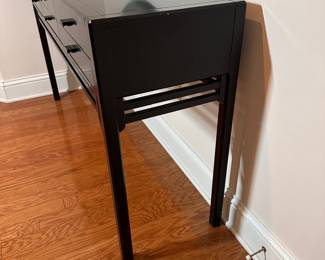 C25 - $550. Black Lacquered Entry Table. From Skaraborgs Mobler. Made in Sweden. Measures 59" x 17" x 33.5" tall. 6 felt lined drawers all slide easily. Very good condition. One white scuff on the front and minor paint chipping on the legs.