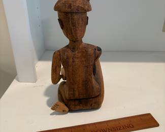 C66 - $15. Vintage Asian Bali Indonesian Hand Carved Wood Figure. Measures 10.25" Tall. The hat has a chip.