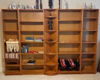 C1 - $200. 5 Piece Bookcase. Shelves are all adjustable. Assembled as it they measure 118.5" across. 2 smaller sections are 19.75" wide x 11.5" deep x 83" tall. 2 larger bookcases are 30.25" wide x 11.5" deep x 83" tall. Center piece could be used on an end or as is. Comes out from the corner 11". Across the front is 16.25".