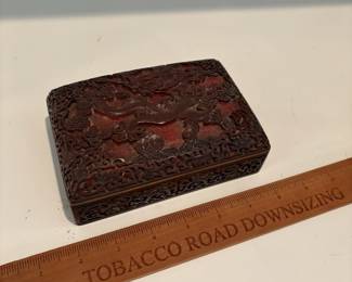 C64 - $75. Chinese Cinnabar Lacquered Box with Blue Enamel Interior. Measures 5.75" x 3.75" x 2.25" tall.