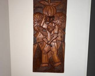 C10 - $30. Carved Relief Wall Art. Measures 12" x 27.5" tall.