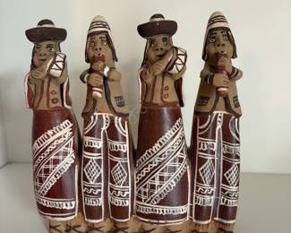 C47 - $25. Peruvian Clay Folk Art Band. Measures 7.25" W x 7.75" Tall