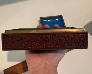C64 - $75. Chinese Cinnabar Lacquered Box with Blue Enamel Interior. Measures 5.75" x 3.75" x 2.25" tall.