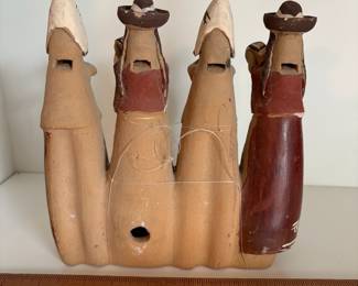 C47 - $25. Peruvian Clay Folk Art Band. Measures 7.25" W x 7.75" Tall