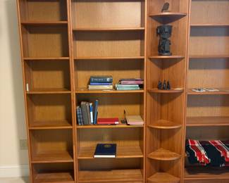 C1 - $200. 5 Piece Bookcase. Shelves are all adjustable. Assembled as it they measure 118.5" across. 2 smaller sections are 19.75" wide x 11.5" deep x 83" tall. 2 larger bookcases are 30.25" wide x 11.5" deep x 83" tall. Center piece could be used on an end or as is. Comes out from the corner 11". Across the front is 16.25".