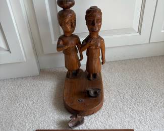 C60 - $20. Tribal Hand Carved Wood Couple. Measures 6" W x 10" D x 14.5" Tall. One piece of the pot is detached but can easily be glued back on.