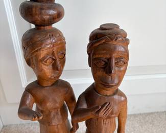 C60 - $20. Tribal Hand Carved Wood Couple. Measures 6" W x 10" D x 14.5" Tall. One piece of the pot is detached but can easily be glued back on.