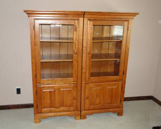 Two enclosed bookshelf cabinets