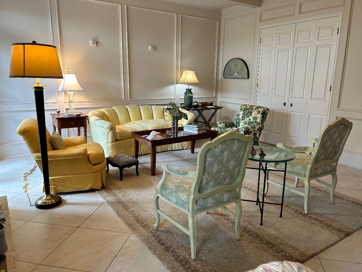 Lovely living room with sets of French style chairs, a fabulous Boden tufted sofa with goose down cushion , antelope rug and more