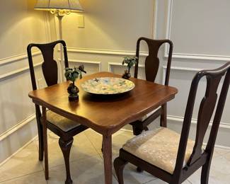 Set of three queen Ann chairs around the game table 