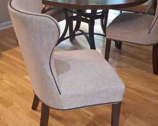 Round Dining Table with Hammered Copper Inlay and Upholstered Chairs second image