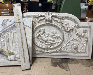 Plaster, cross, and canvas wall hangings