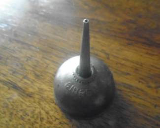 Singer oil can