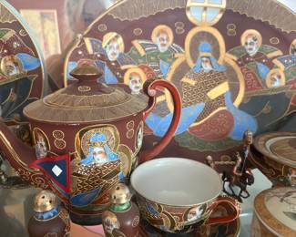 This is a vintage Japanese Satsuma Moriage tea set, highly collectible for its rich hand-painted details, raised "Moriage" enamel, and often 24k gold gilding.