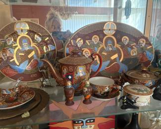 This is a vintage Japanese Satsuma Moriage tea set, highly collectible for its rich hand-painted details, raised "Moriage" enamel, and often 24k gold gilding.