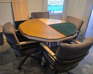 Small kitchette table with 4 chairs and a leaf to make it a oval with cut heaters for the top