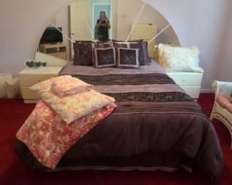 Queensize bed with mirrored headboard