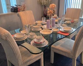 Beautiful thick glass Pedastal dining table with cream Grey and peach type marks