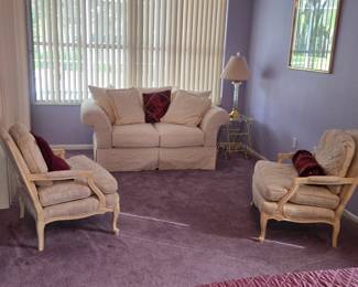 2 comfortable armed chairs and a love seat