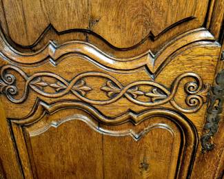 Intricately carved oak 8' armoire with ornate Rococo style details