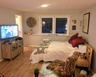 Bed with attached nightstands, bedding included