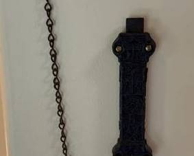 Antique cast iron spring-loaded door latch