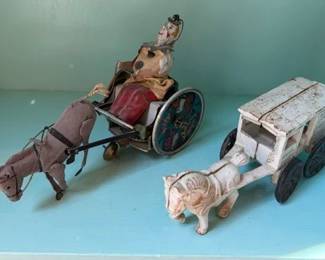 Lehmann 'Balking Mule' tin toy, ca 1920, and cast iron milk truck toy