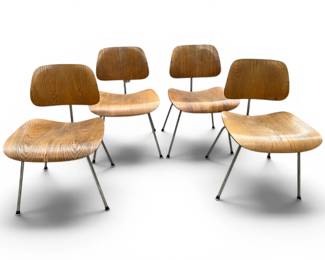 Four labeled Eames Herman Miller chairs