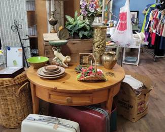 Round wood table, vintage luggage