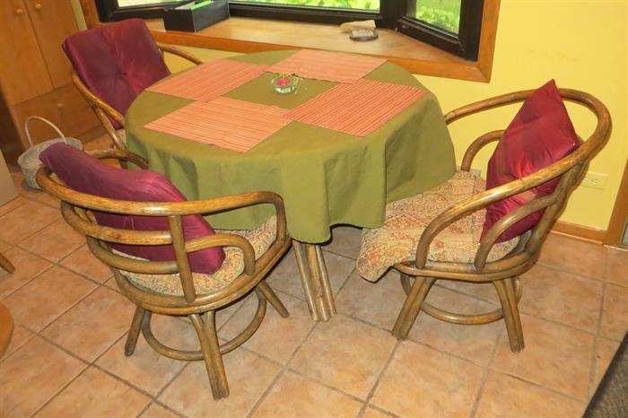 Rattan table with three chairs (fourth is available but needs repair)