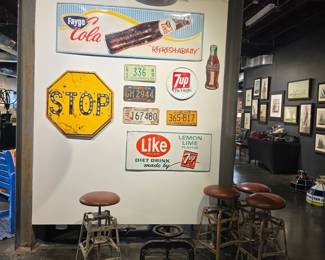 Collection of Vintage Advertising Signs and License Plates including Faygo Cola, 7Up, Coca-Cola, and others