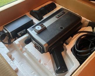 Panasonic PK-200 vintage color video camera with original packaging, including a detachable lens and viewfinder. Retro design.