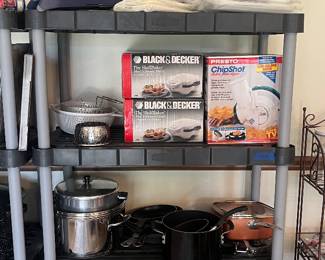 Brand new pots, pans, and cookware items. Food saver.