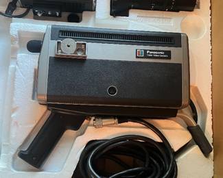 Panasonic PK-200 vintage color video camera with original packaging, including a detachable lens and viewfinder. Retro design.