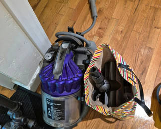 Lot 94: Dyson vacuum with hose and accessories
