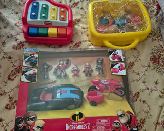 Lot 55: Incredibles 2 action figures with vehicles, xylophone, and Mr. Potato Head set