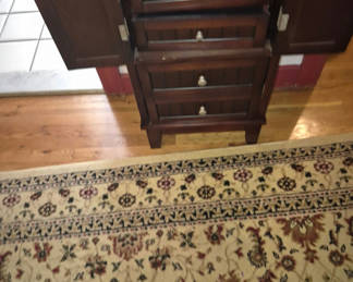 Lot 60: Dark wood jewelry armoire with multiple drawers