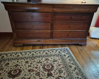 Lot 62: Eight-drawer dark wood dresser